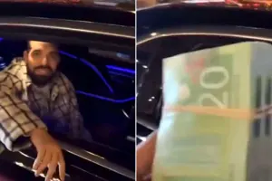 Dreyk küçədə insanlara pul payladı