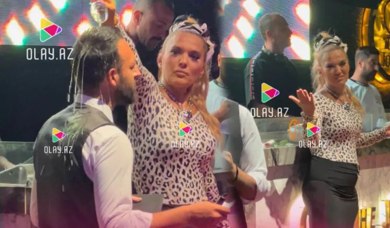 Şampanı klub işçisinin başına tökdü